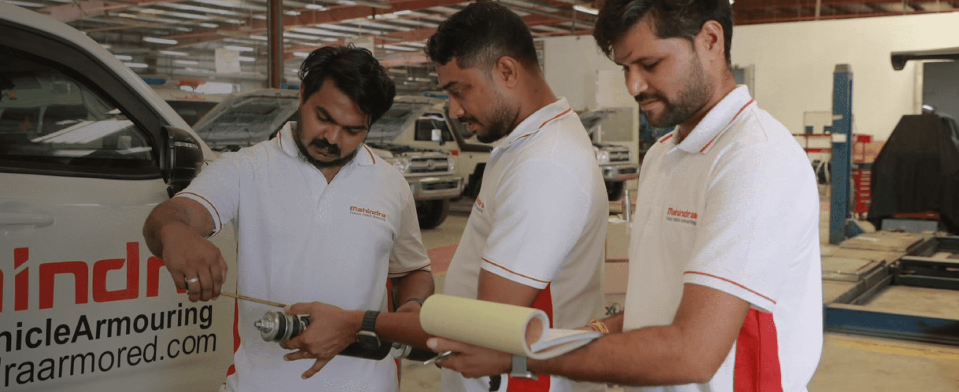 MEVA engineers reviewing drawings together on the production floor